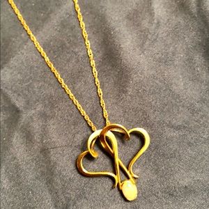 Double heart pendant with opal in 14k yellow gold